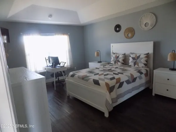 a bedroom with a bed and a table in it