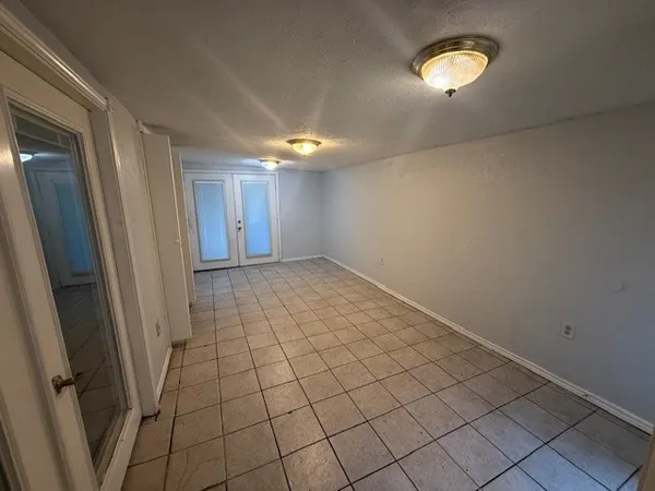 a view of an empty room and window