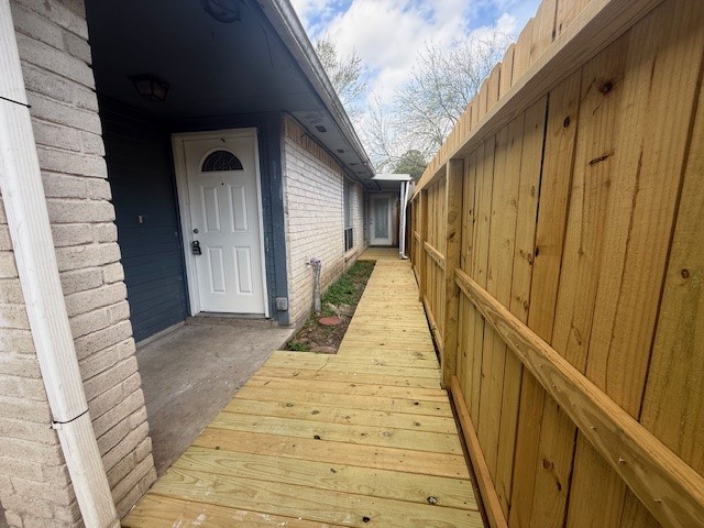 3105 Oak Rock Spring, TX 77373 - Photo 2 of 14 a view of balcony with wooden floor and stairs