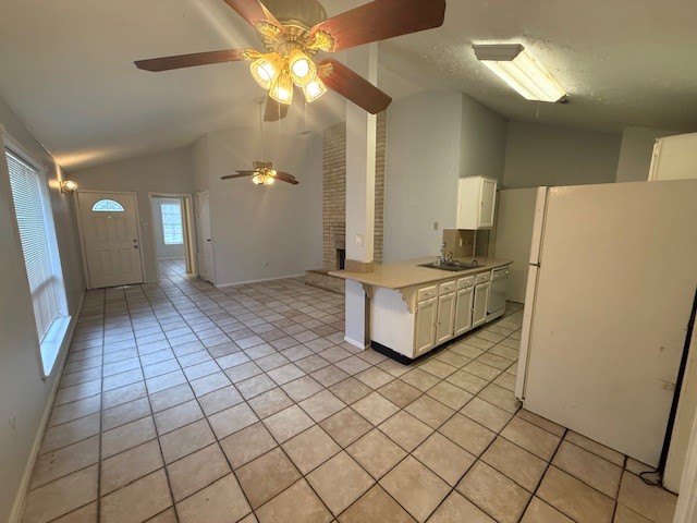3105 Oak Rock Spring, TX 77373 - Photo 4 of 14 a living room with a couch and a chandelier