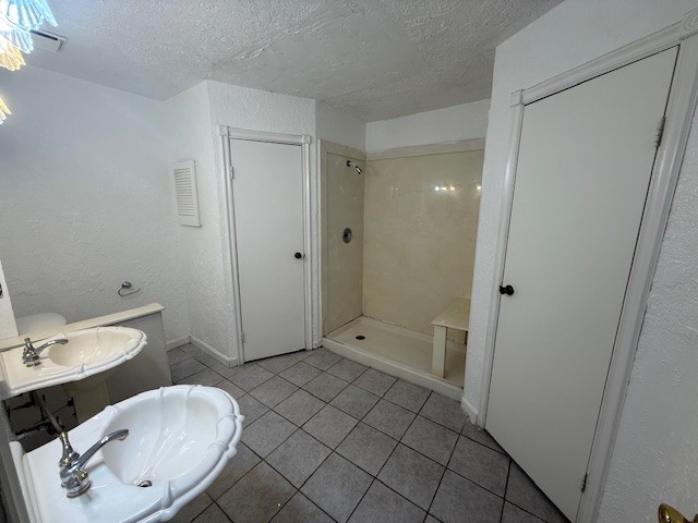 3105 Oak Rock Spring, TX 77373 - Photo 7 of 14 a bathroom with a sink toilet and shower