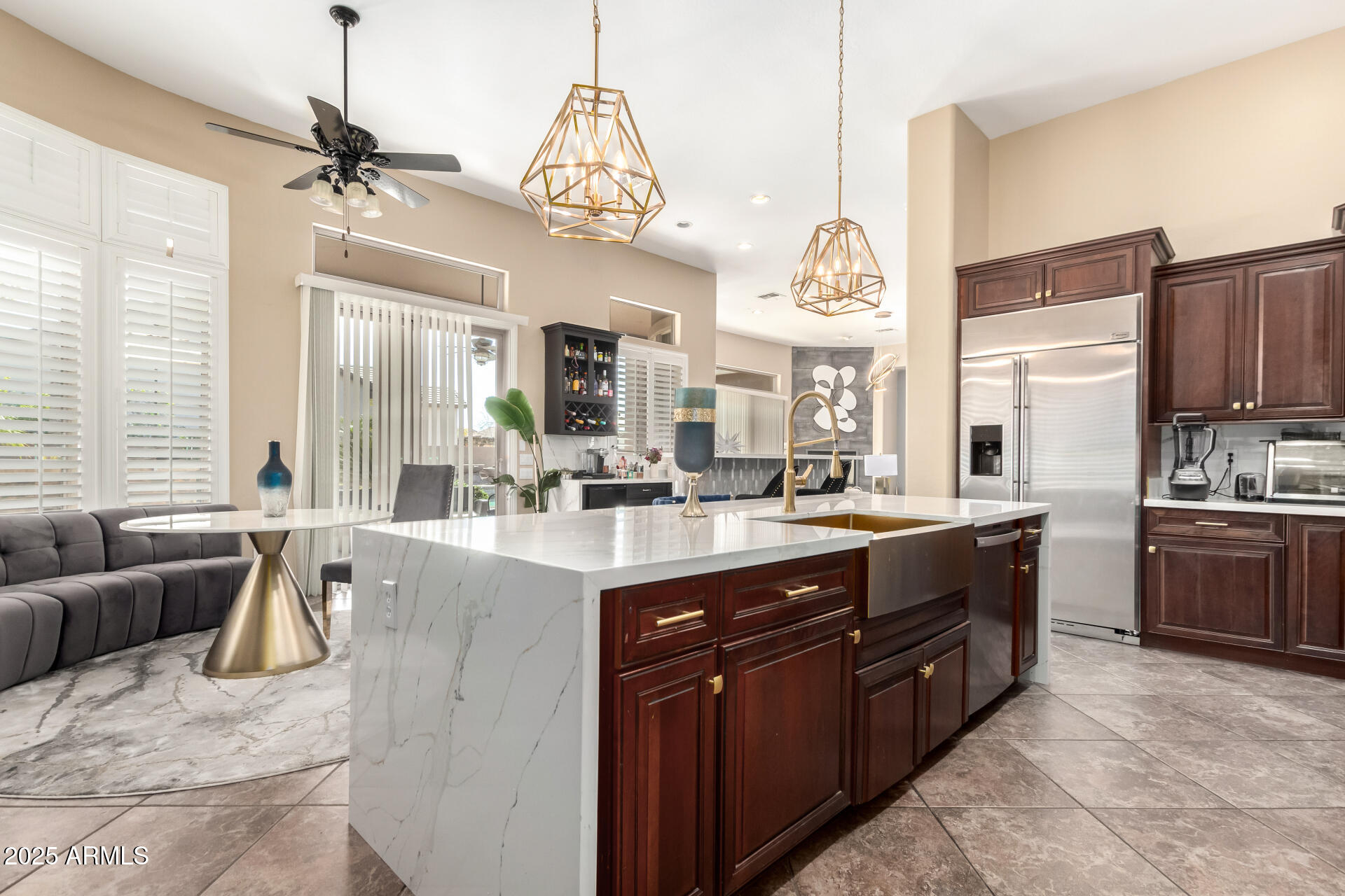 4935 West Yearling Road Phoenix, AZ 85083 - Photo 16 of 48 a large kitchen with kitchen island granite countertop a large center island attached withe living room
