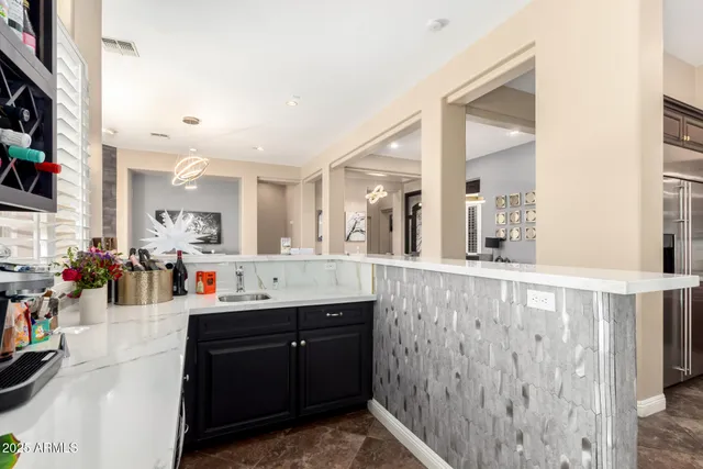 a bedroom with a bed a couch and a window