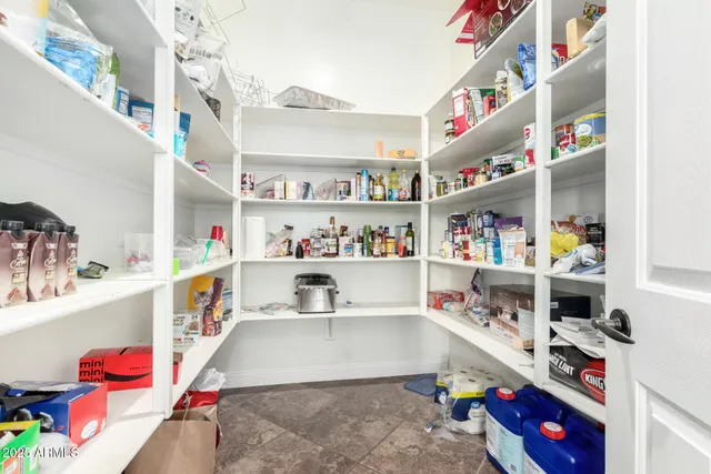 a bedroom with a bed and a table