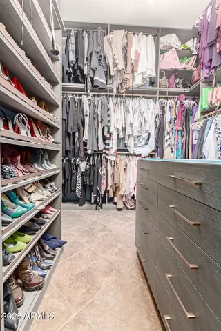 a bathroom with a sink a toilet a mirror a vanity and shower