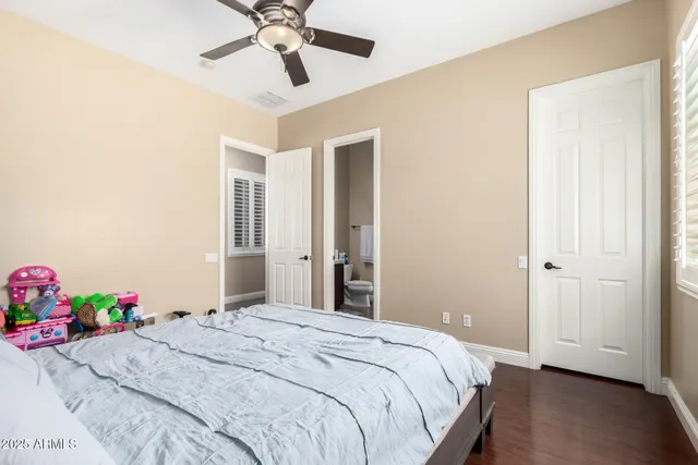 a bedroom with a bed and a dresser