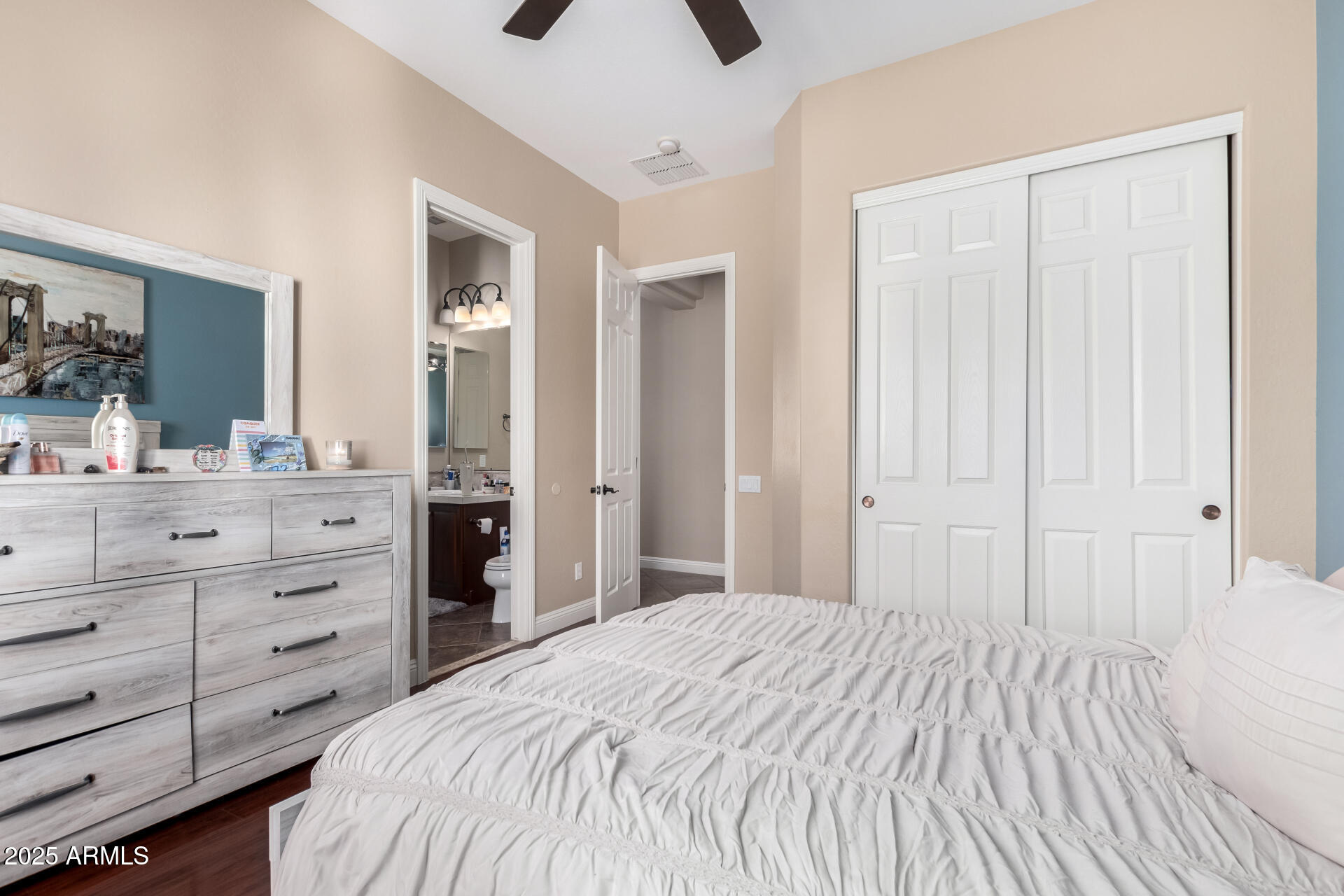 4935 West Yearling Road Phoenix, AZ 85083 - Photo 32 of 48 a bedroom with a bed and a dresser