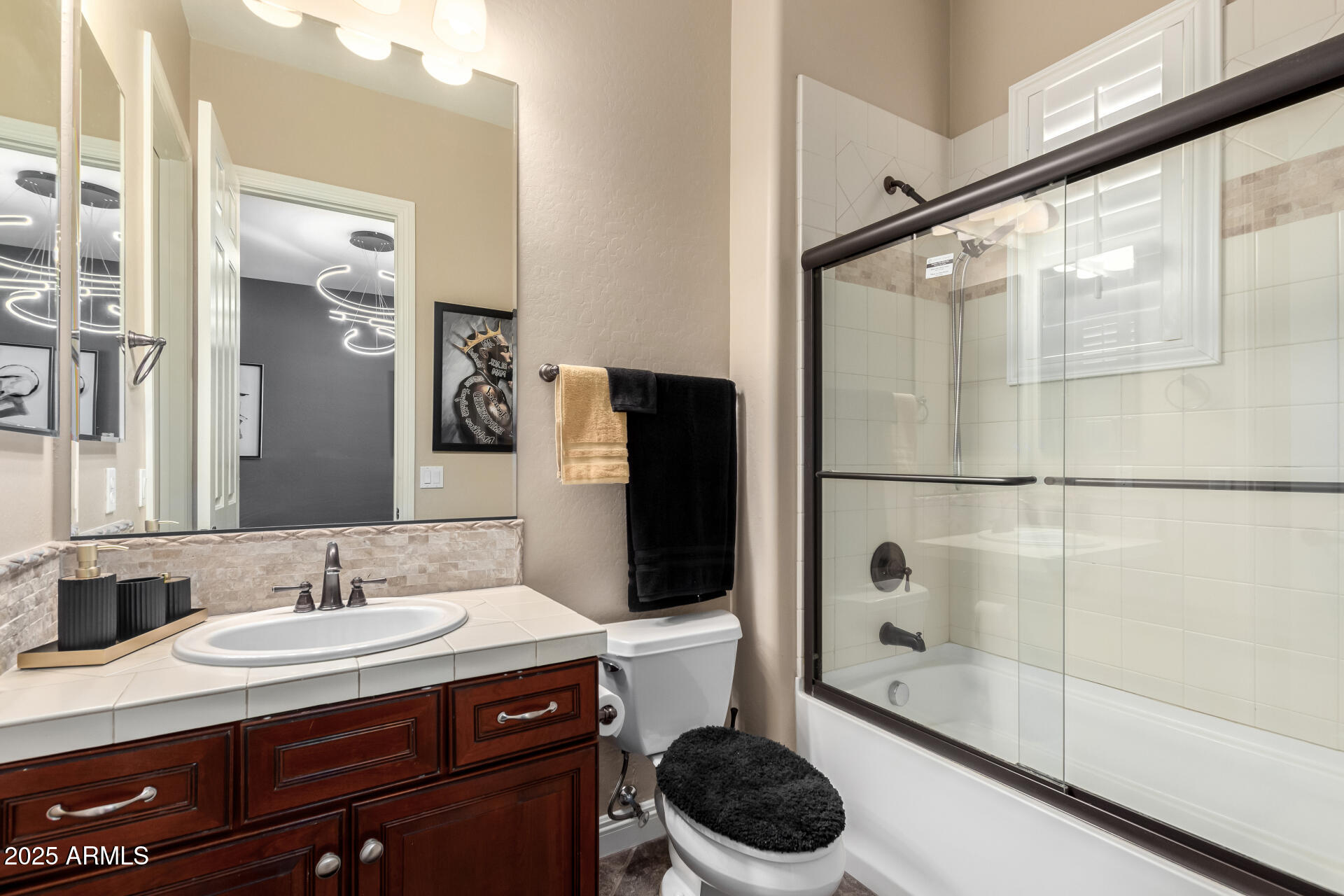 4935 West Yearling Road Phoenix, AZ 85083 - Photo 35 of 48 a bathroom with a granite countertop sink a toilet and shower