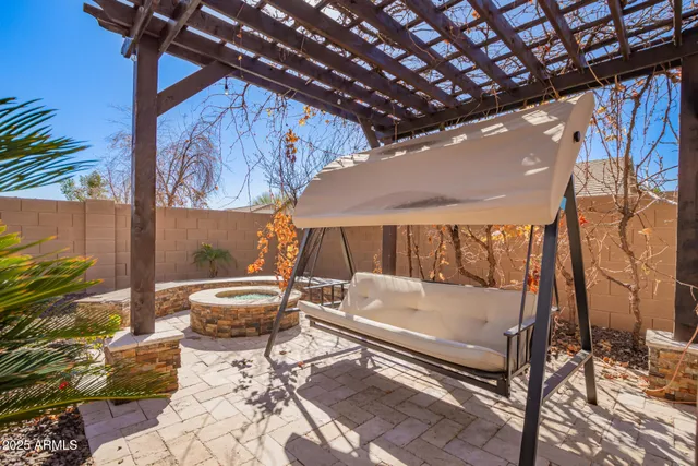a view of a backyard with plants and a patio
