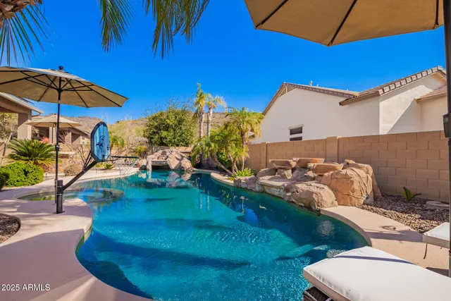 a view of a backyard with outdoor kitchen