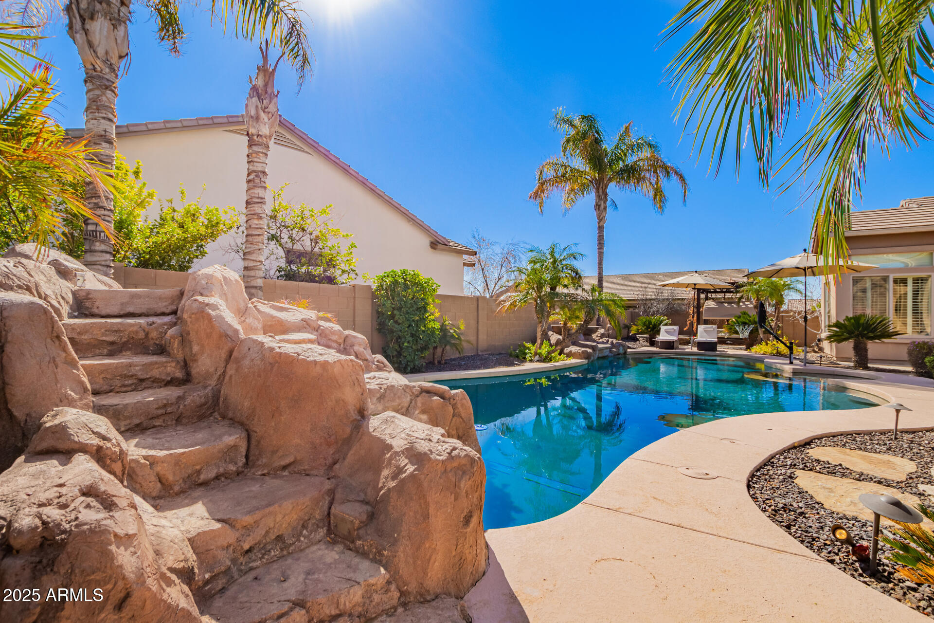 4935 West Yearling Road Phoenix, AZ 85083 - Photo 41 of 48 a view of a backyard with plants and a patio