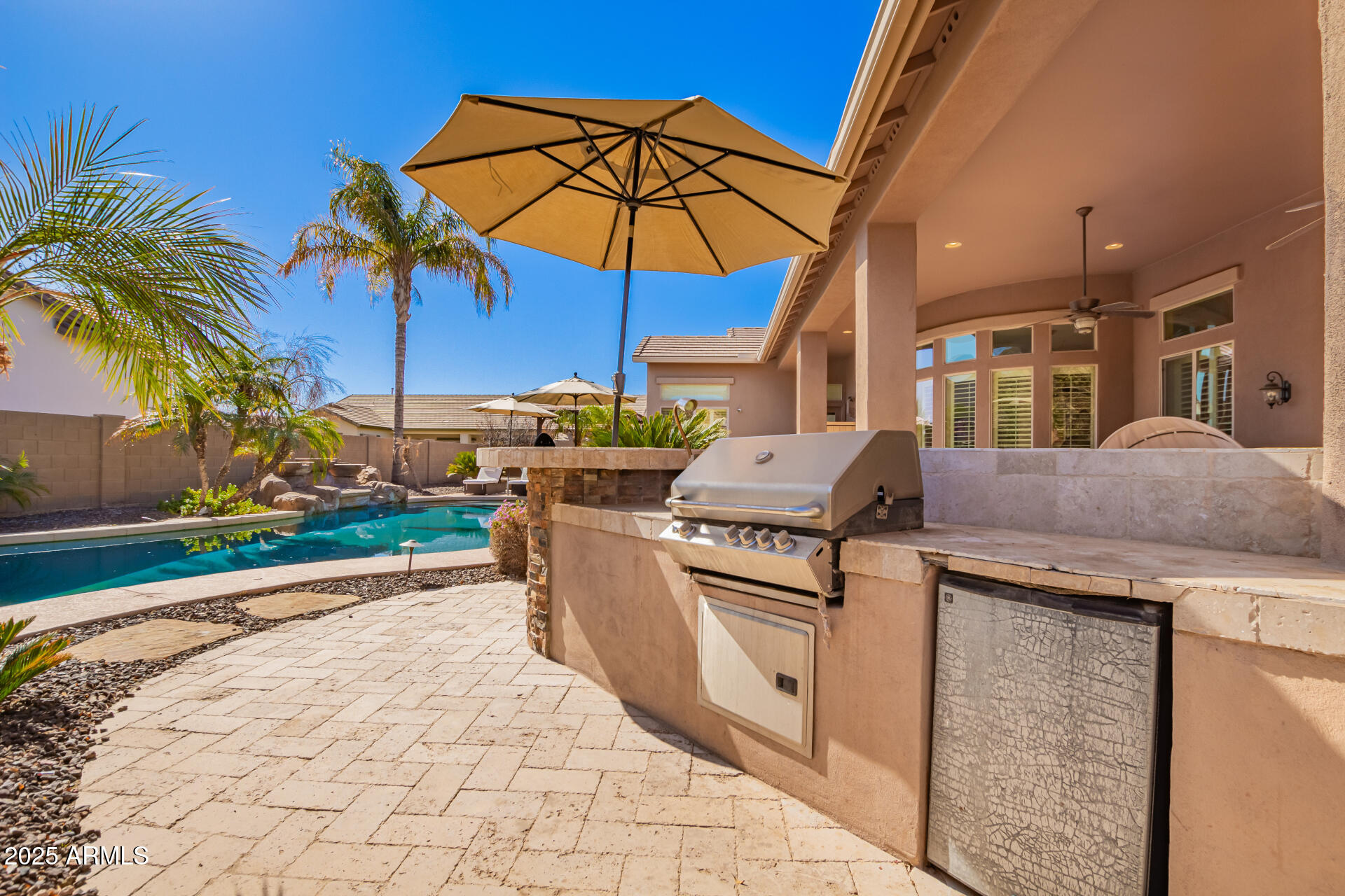 4935 West Yearling Road Phoenix, AZ 85083 - Photo 42 of 48 a view of a backyard with outdoor kitchen