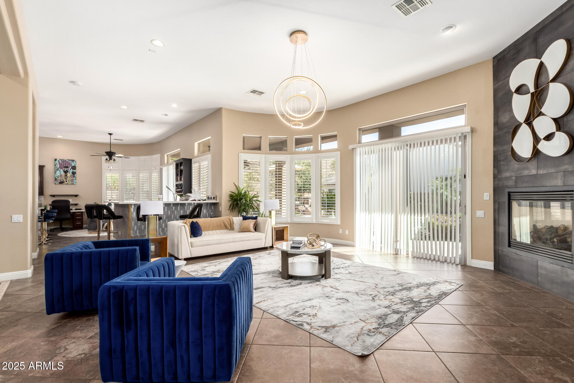 4935 West Yearling Road Phoenix, AZ 85083 - Photo 8 of 48 a living room with furniture a large window and stainless steel appliances