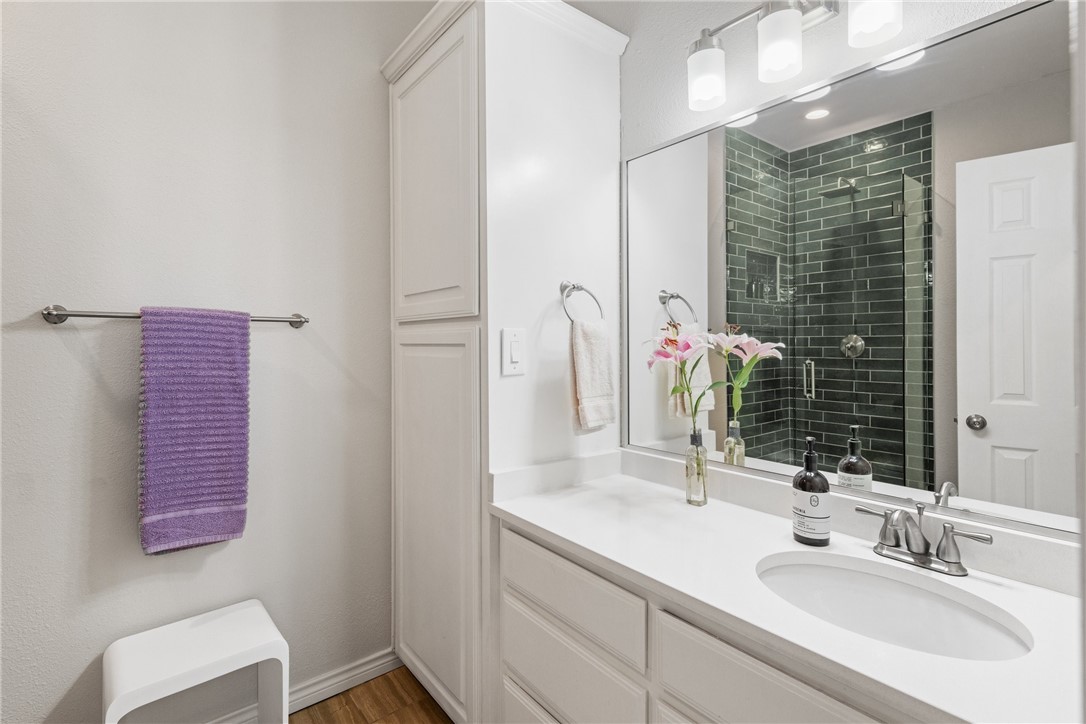 4658 Oso Parkway Corpus Christi, TX 78413 - Photo 14 of 33 a bathroom with a sink vanity granite and a mirror