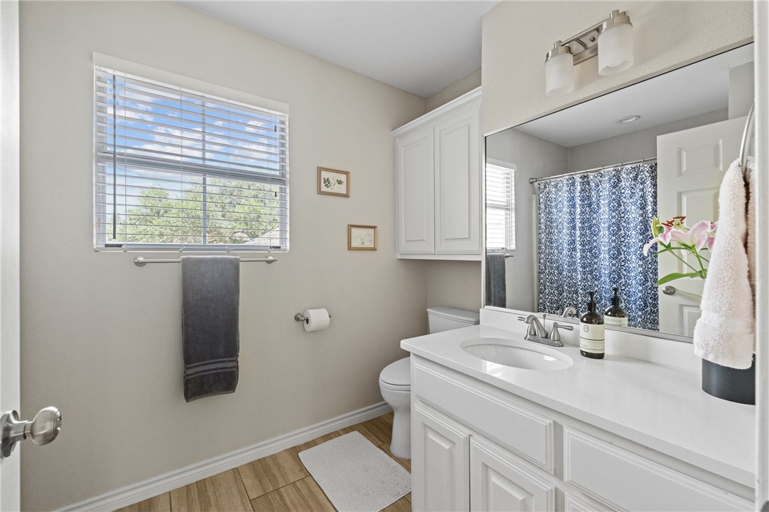 4658 Oso Parkway Corpus Christi, TX 78413 - Photo 17 of 33 a bathroom with a sink and a mirror
