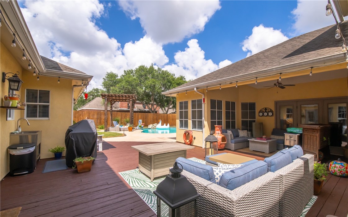 4658 Oso Parkway Corpus Christi, TX 78413 - Photo 23 of 33 a view of a patio with couches chairs and potted plants
