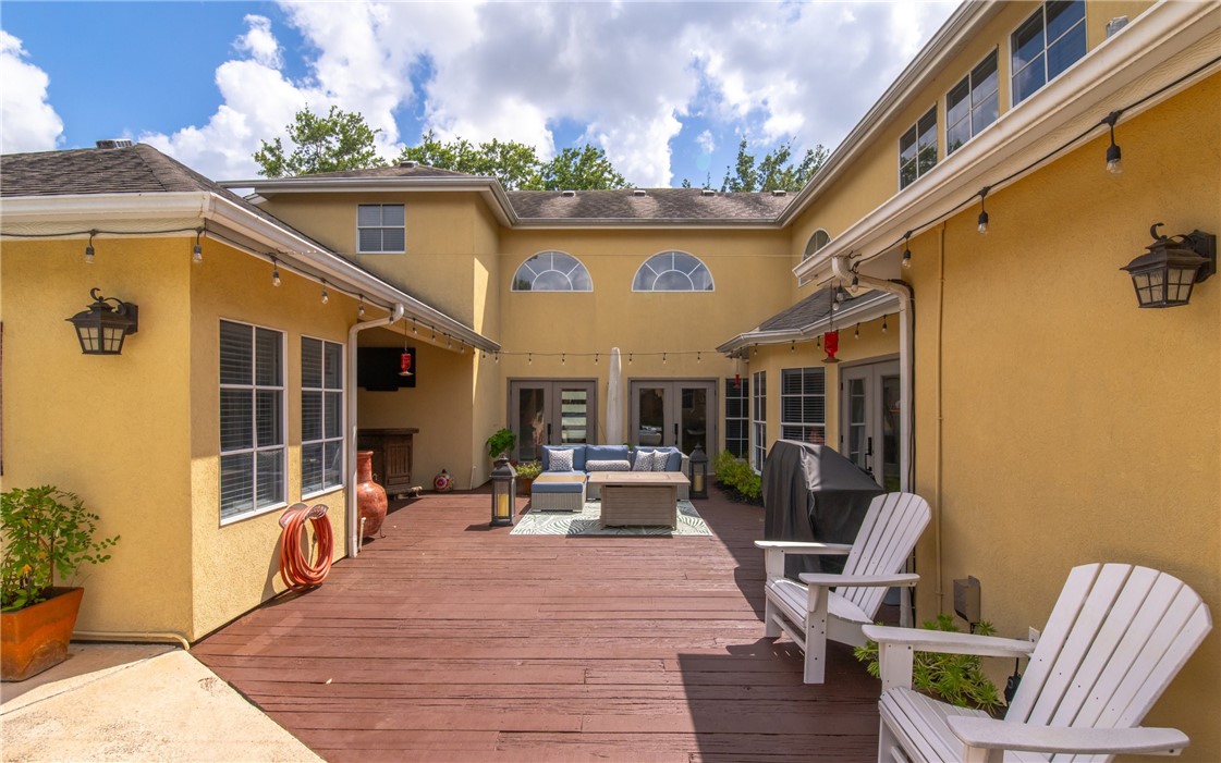 4658 Oso Parkway Corpus Christi, TX 78413 - Photo 24 of 33 a outdoor space with patio the couches and potted plants