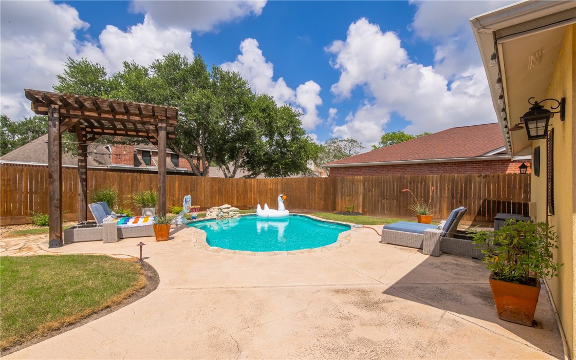 4658 Oso Parkway Corpus Christi, TX 78413 - Photo 25 of 33 a backyard of a house with outdoor seating