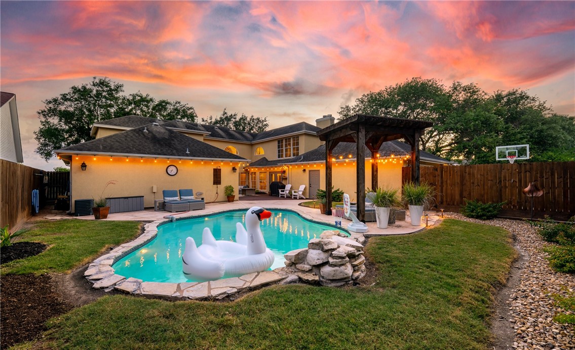 4658 Oso Parkway Corpus Christi, TX 78413 - Photo 27 of 33 a view of a swimming pool with a yard