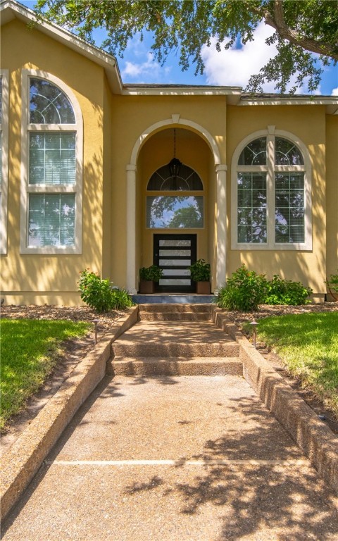 4658 Oso Parkway Corpus Christi, TX 78413 - Photo 28 of 33 a front view of a house with a garden