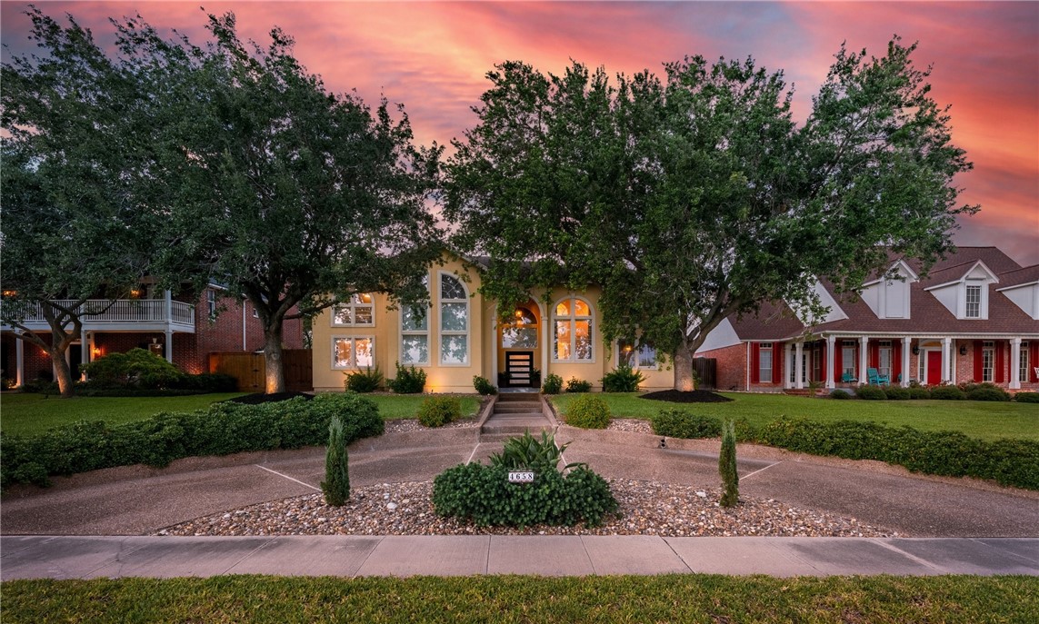 4658 Oso Parkway Corpus Christi, TX 78413 - Photo 29 of 33 a front view of a house with garden