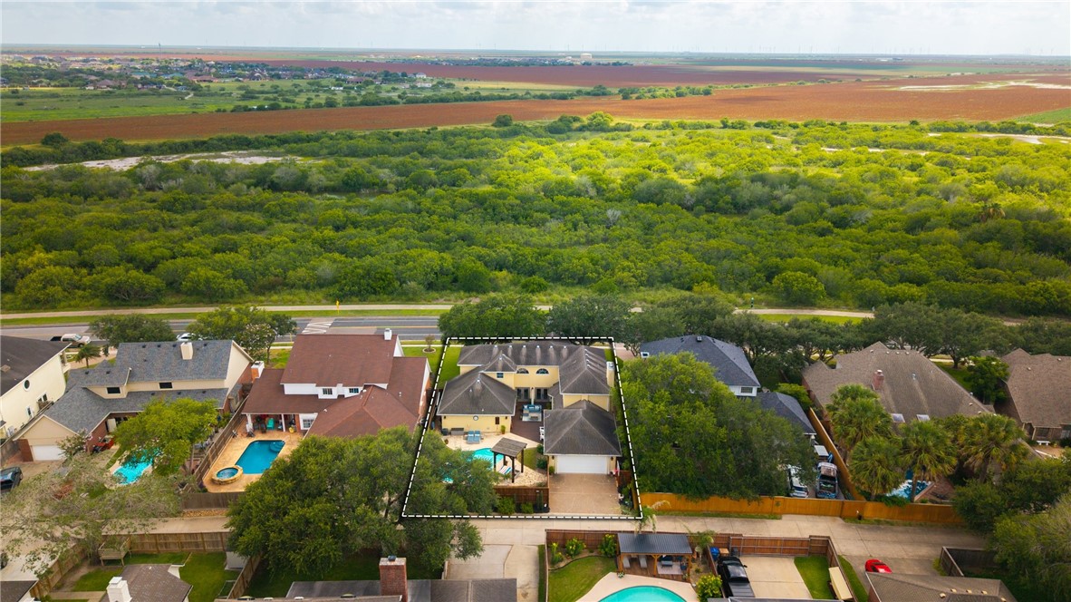 4658 Oso Parkway Corpus Christi, TX 78413 - Photo 30 of 33 an aerial view of residential houses with outdoor space and ocean view