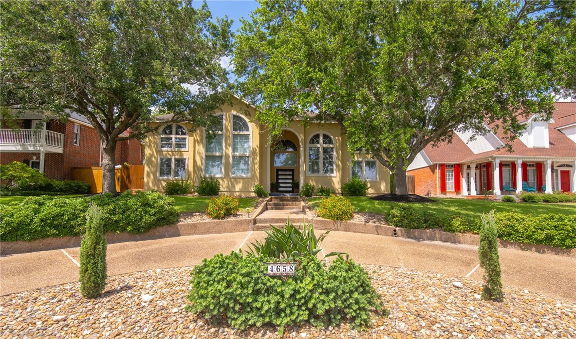 4658 Oso Parkway Corpus Christi, TX 78413 - Photo 33 of 33 a front view of a house with garden and porch