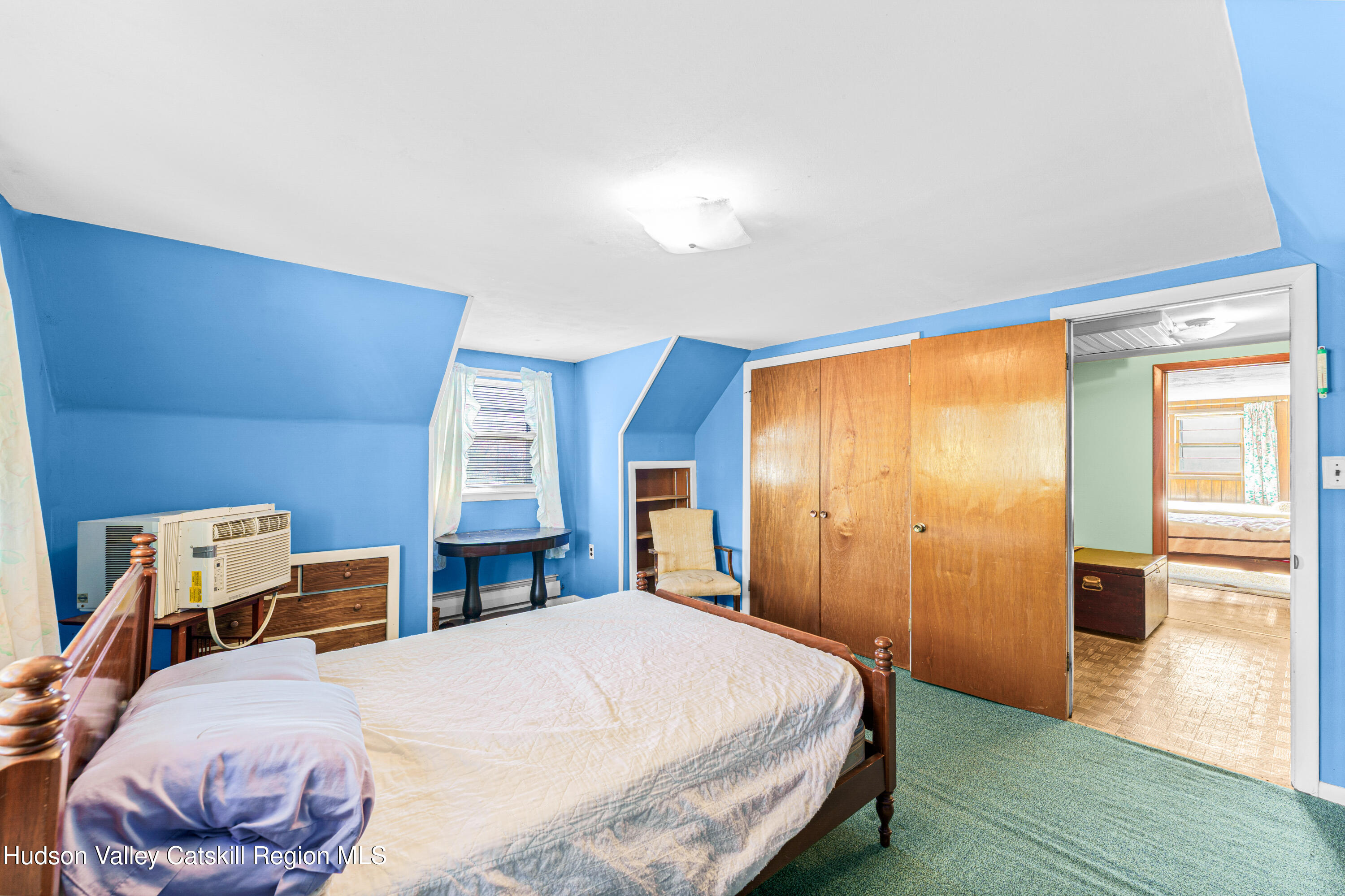 41 Fish Road Oak Hill, NY 12460 - Photo 11 of 37 a bedroom with a bed and wooden floor