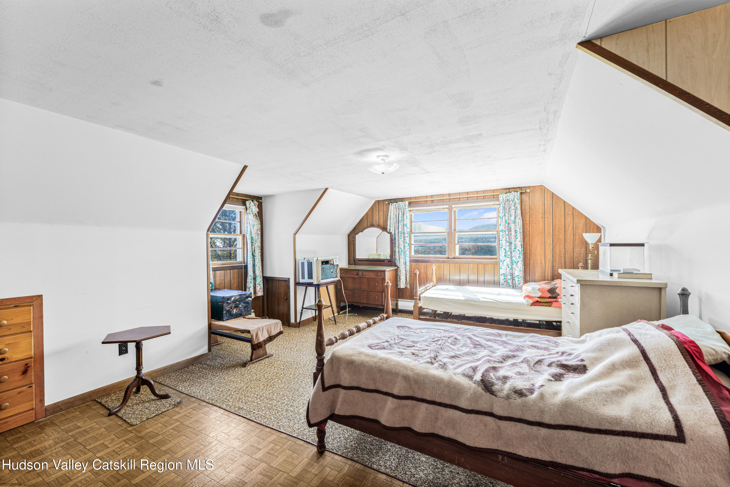 41 Fish Road Oak Hill, NY 12460 - Photo 13 of 37 a bedroom with a large bed and a large window