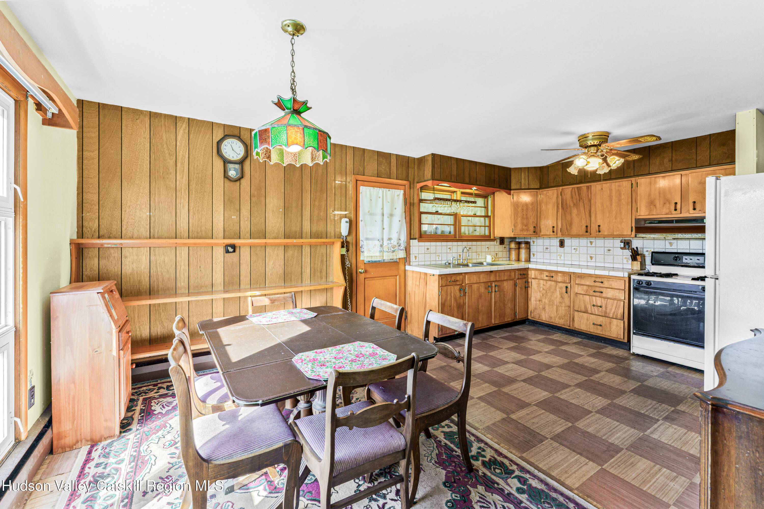 41 Fish Road Oak Hill, NY 12460 - Photo 4 of 37 a kitchen with a table chairs and entryway