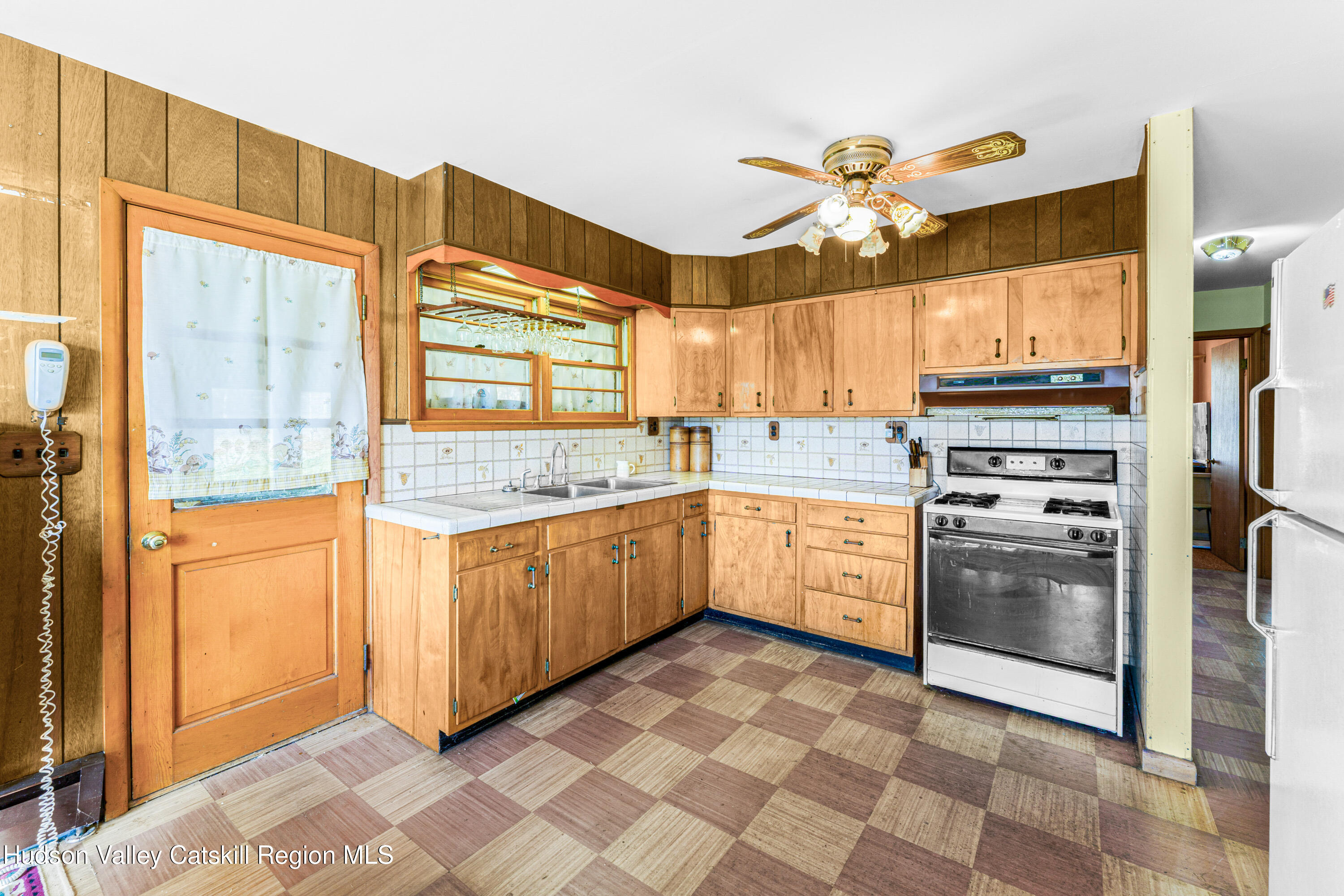41 Fish Road Oak Hill, NY 12460 - Photo 5 of 37 a kitchen with a stove a sink and a refrigerator