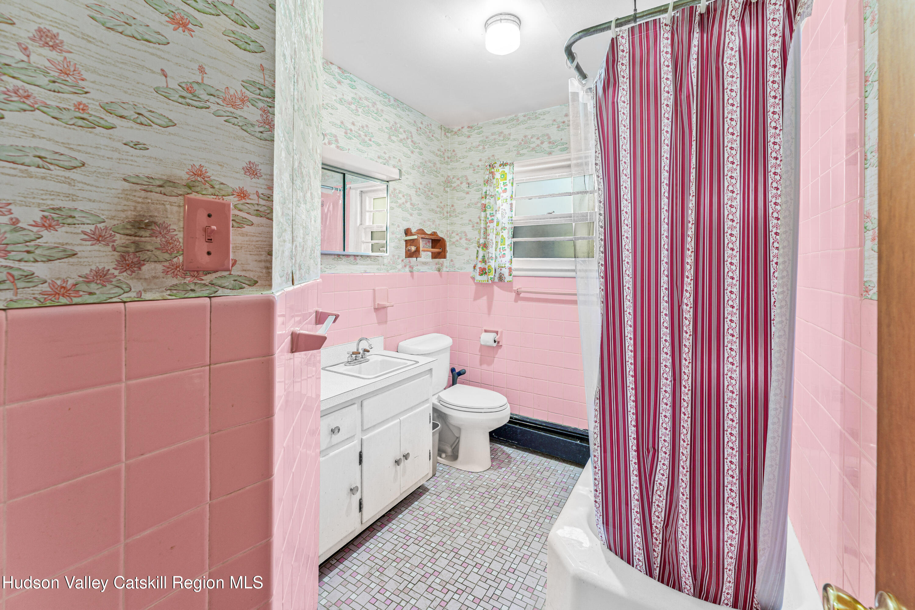 41 Fish Road Oak Hill, NY 12460 - Photo 7 of 37 a bathroom with a sink a toilet and shower curtain