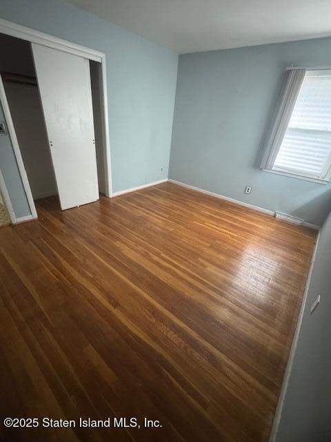 61 Morton Street Staten Island, NY 10306 - Photo 12 of 18 a bedroom with a bed and a window