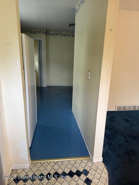 61 Morton Street Staten Island, NY 10306 - Photo 4 of 18 a view of a hallway with wooden floor and staircase