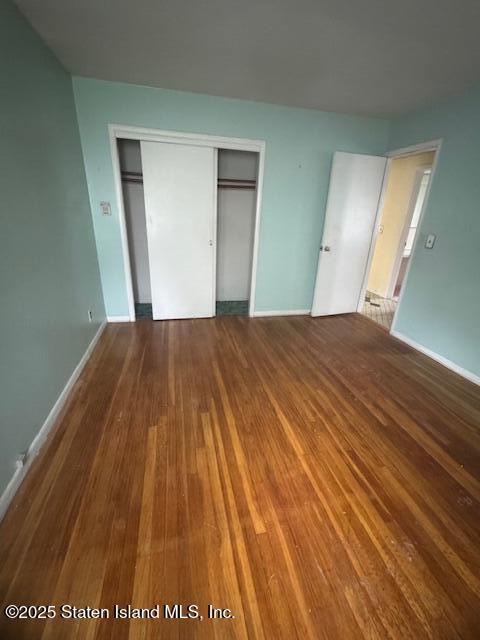 61 Morton Street Staten Island, NY 10306 - Photo 9 of 18 a view of empty room with wooden floor