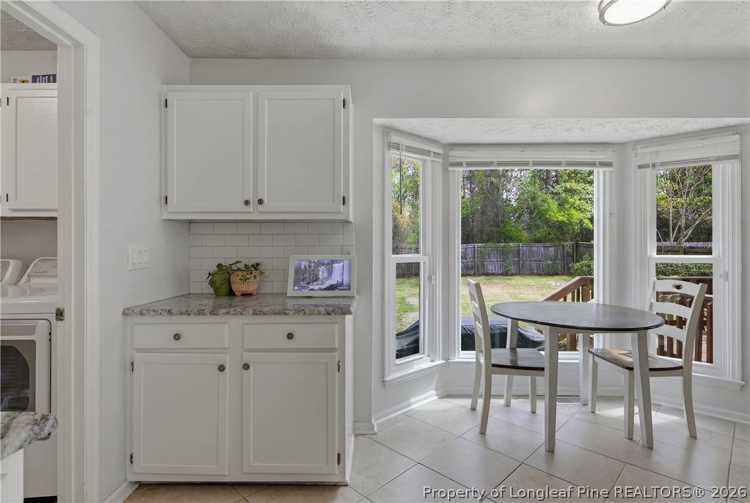 1837 Nuthatch Road Fayetteville, NC 28304 - Photo 17 of 43 a view of a dining room with furniture window and outside view