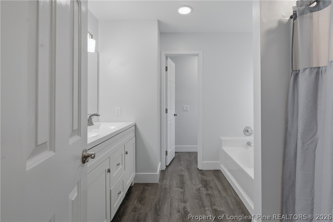 1837 Nuthatch Road Fayetteville, NC 28304 - Photo 26 of 43 a bathroom with a double vanity sink and mirror