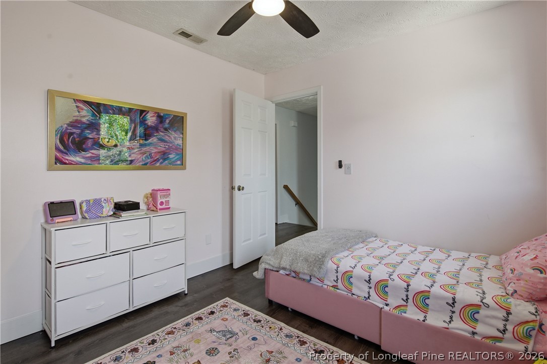 1837 Nuthatch Road Fayetteville, NC 28304 - Photo 35 of 43 a bedroom with a bed and a painting on the wall