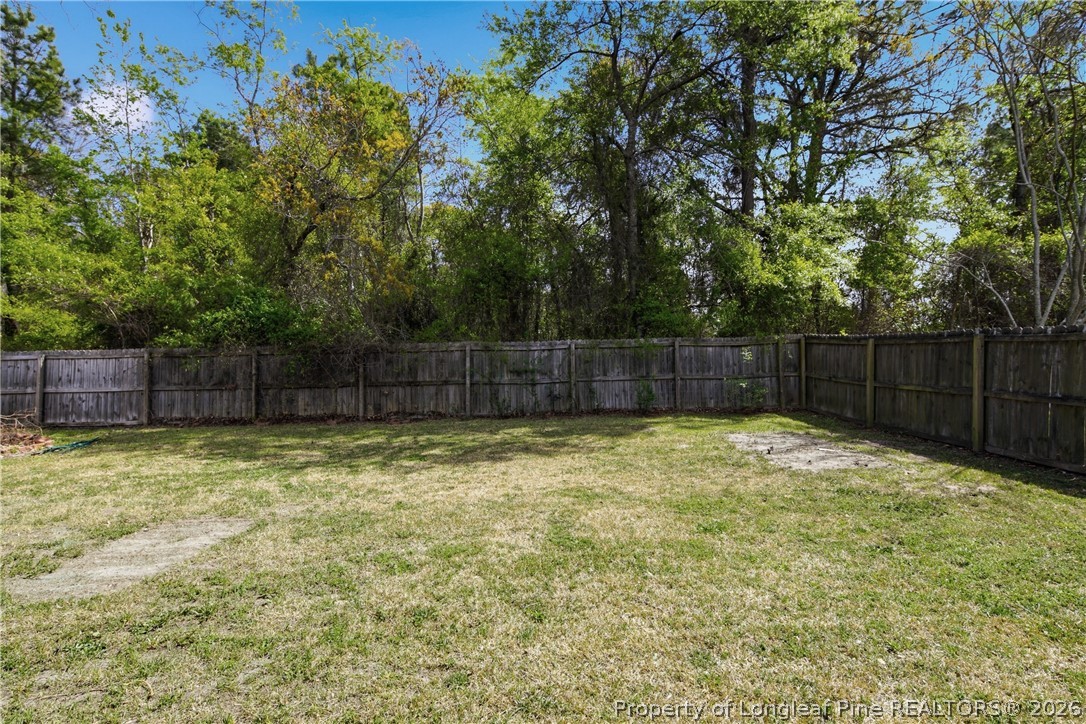 1837 Nuthatch Road Fayetteville, NC 28304 - Photo 43 of 43 a view of a yard with wooden fence