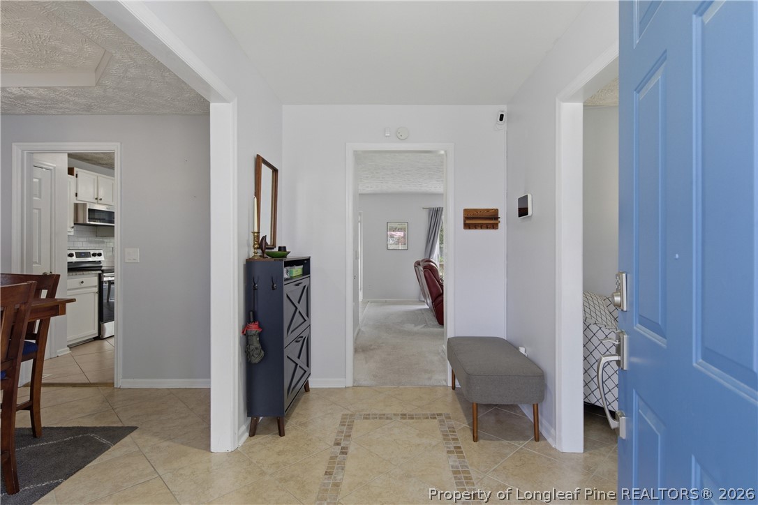 1837 Nuthatch Road Fayetteville, NC 28304 - Photo 5 of 43 a view of a hallway with furniture and closet