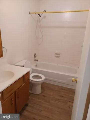 a bathroom with a toilet sink and shower