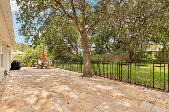 a view of a backyard with a lake view