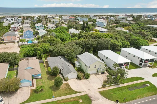 an aerial view of residential houses with outdoor space