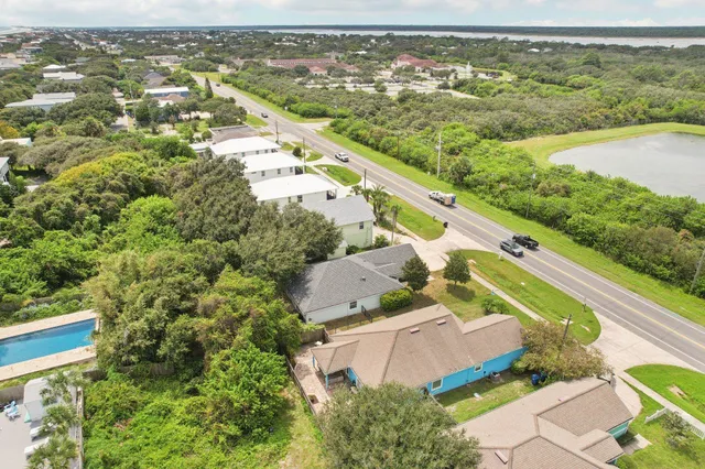 an aerial view of residential houses with outdoor space