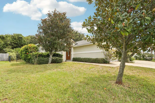 a house with trees in front of it