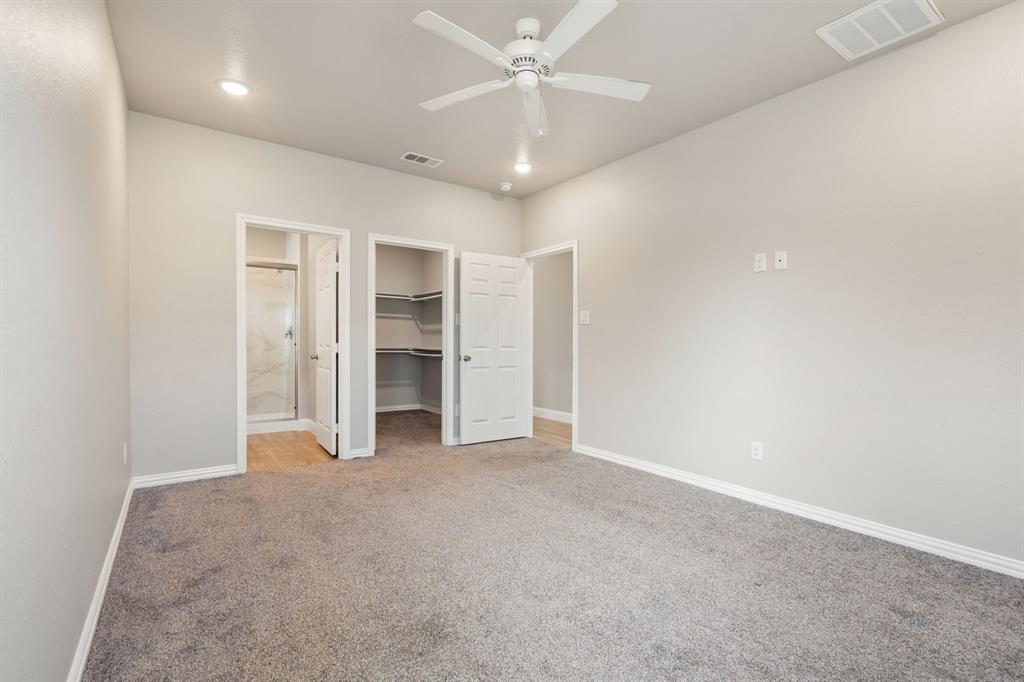 2306 Church Street Greenville, TX 75401 - Photo 14 of 24 an empty room with a ceiling fan and closet
