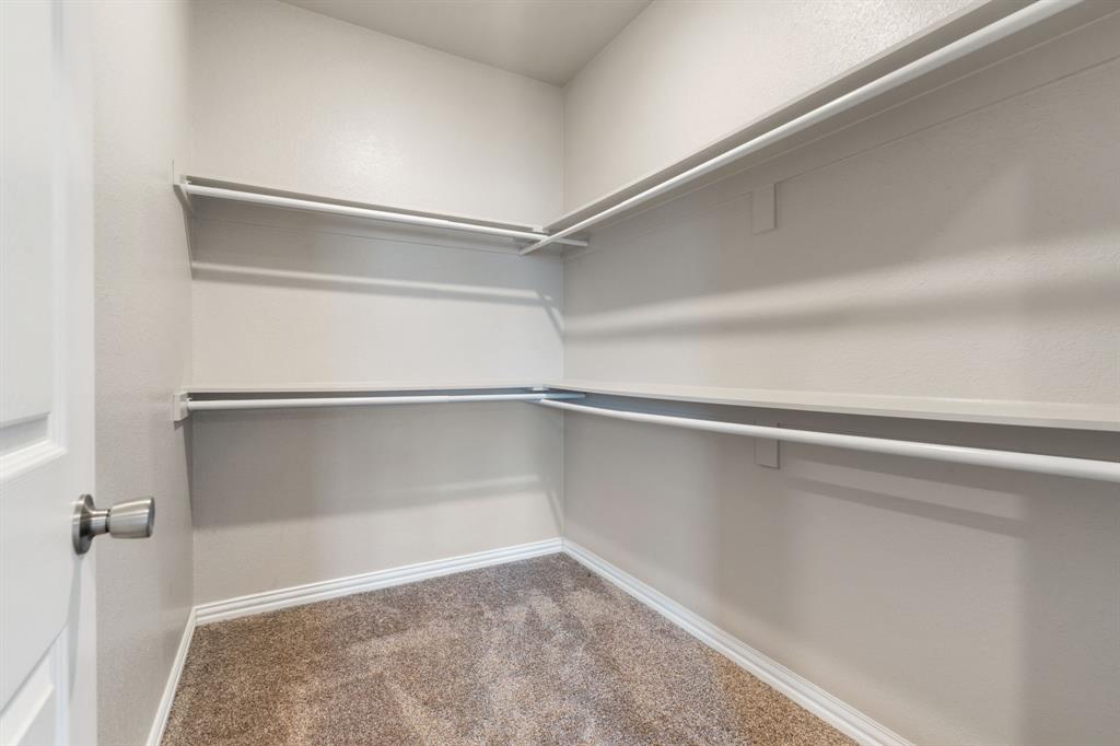 2306 Church Street Greenville, TX 75401 - Photo 16 of 24 a view of an empty walk in closet