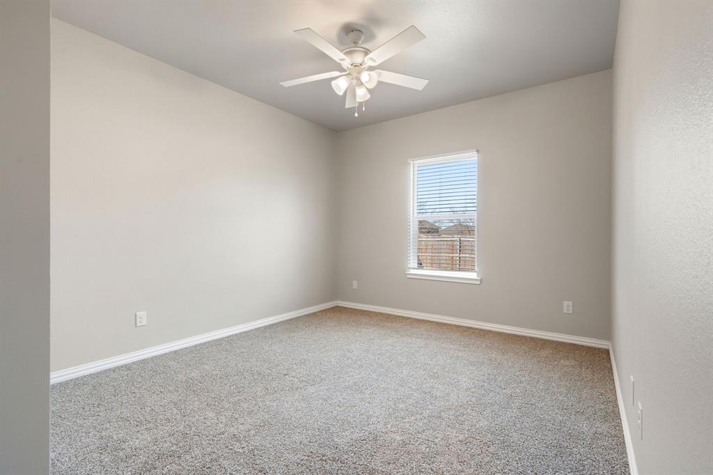 2306 Church Street Greenville, TX 75401 - Photo 17 of 24 a view of an empty room with a window