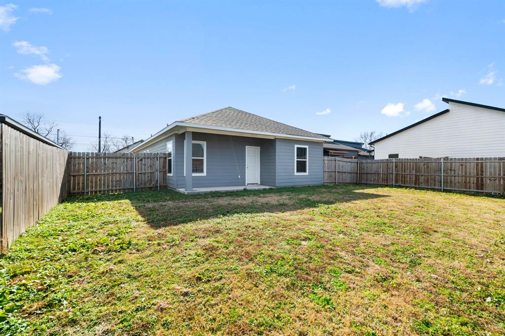 2306 Church Street Greenville, TX 75401 - Photo 23 of 24 a backyard of a house