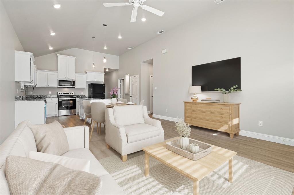 2306 Church Street Greenville, TX 75401 - Photo 3 of 24 a living room with furniture and a flat screen tv